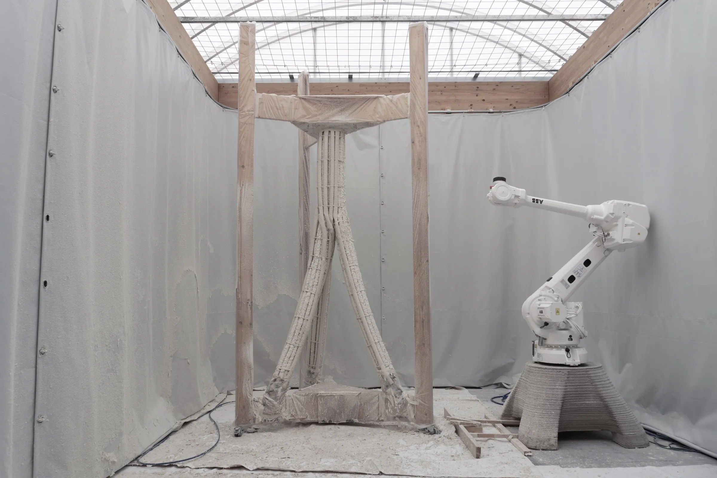 Freestanding cellulose column prototype photographed against a plain wall.